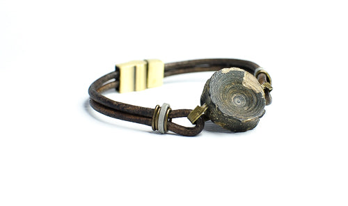 vertebracelet by Foxy Fossils featuring authentic fossil shark vertebra on leather straps with slide lock magnetic clasp