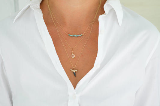 Dainty layered shark tooth necklace in gold-authentic fossilized shark tooth —elegant fossil necklace modeled—Foxy Fossils 