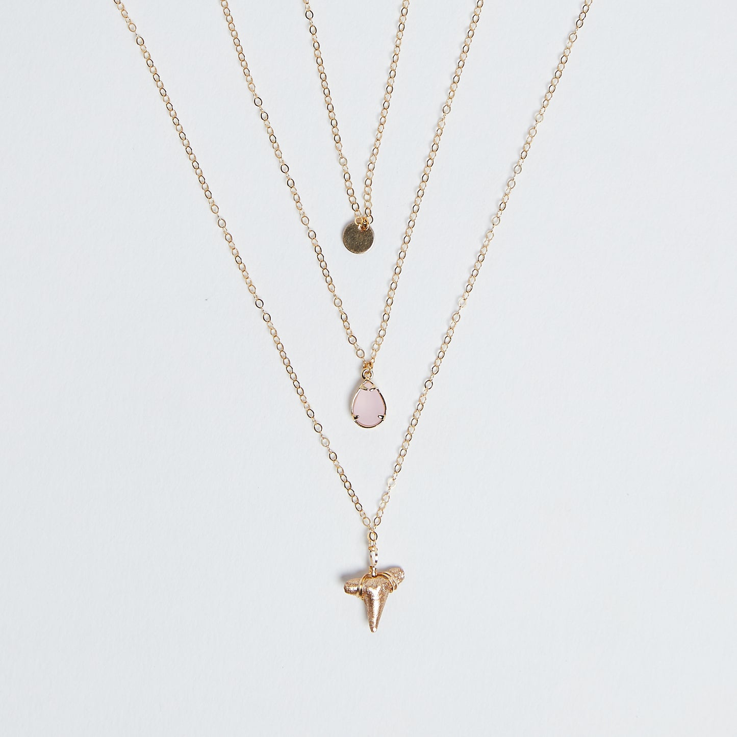 East Coast Vibes - Foxy Fossils 3 layer gold shark tooth necklace with light rose pink quartz crystal charm