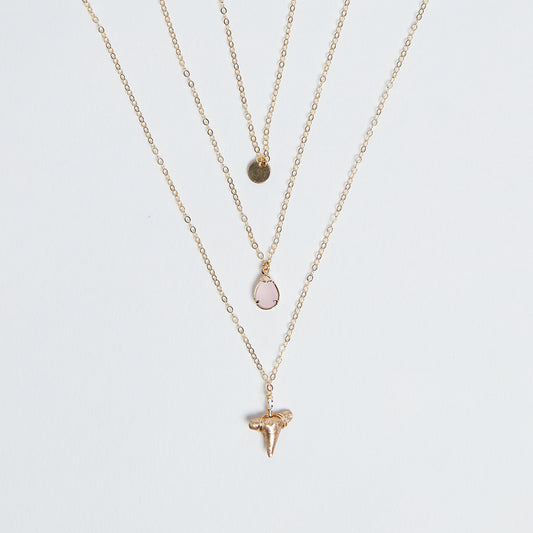 East Coast Vibes - Foxy Fossils 3 layer gold shark tooth necklace with light rose pink quartz crystal charm