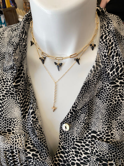 shark teeth on gold link chain necklace styled on mannequin - foxy fossils