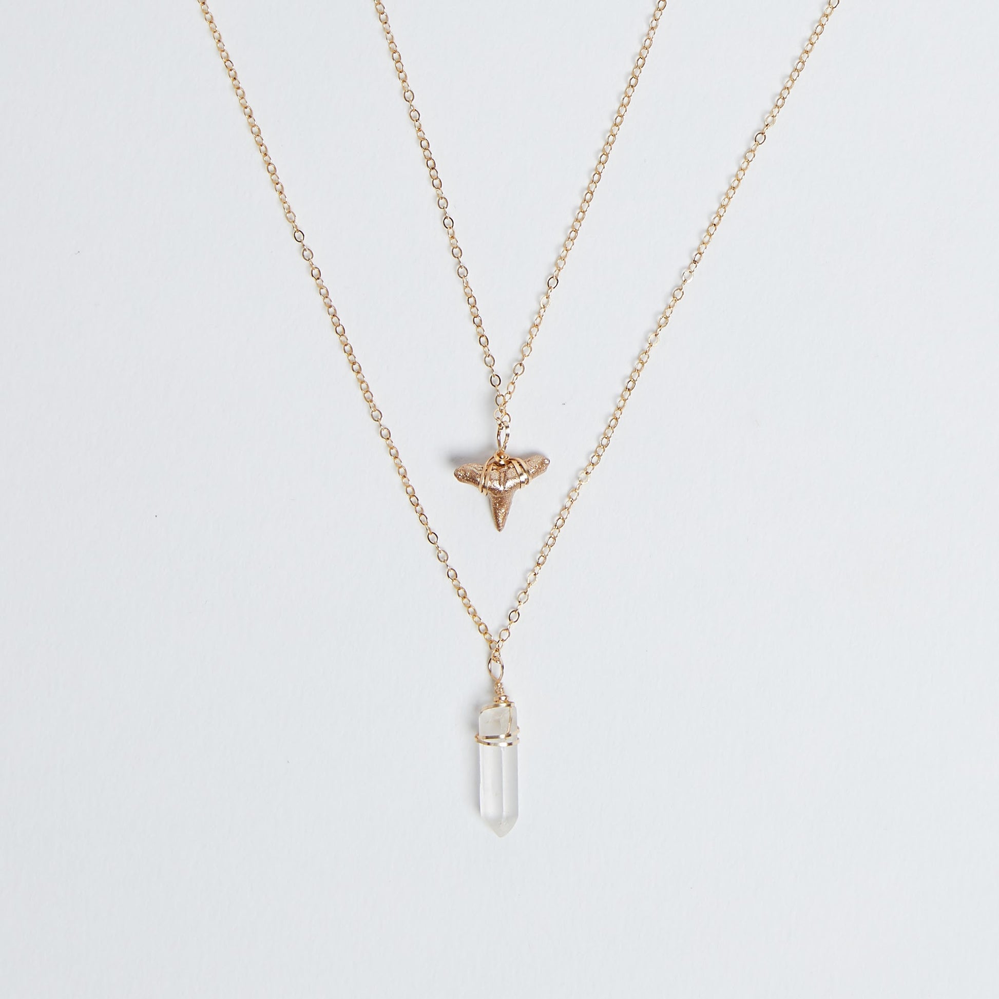2 layer gold shark tooth necklace with quartz crystal pendant