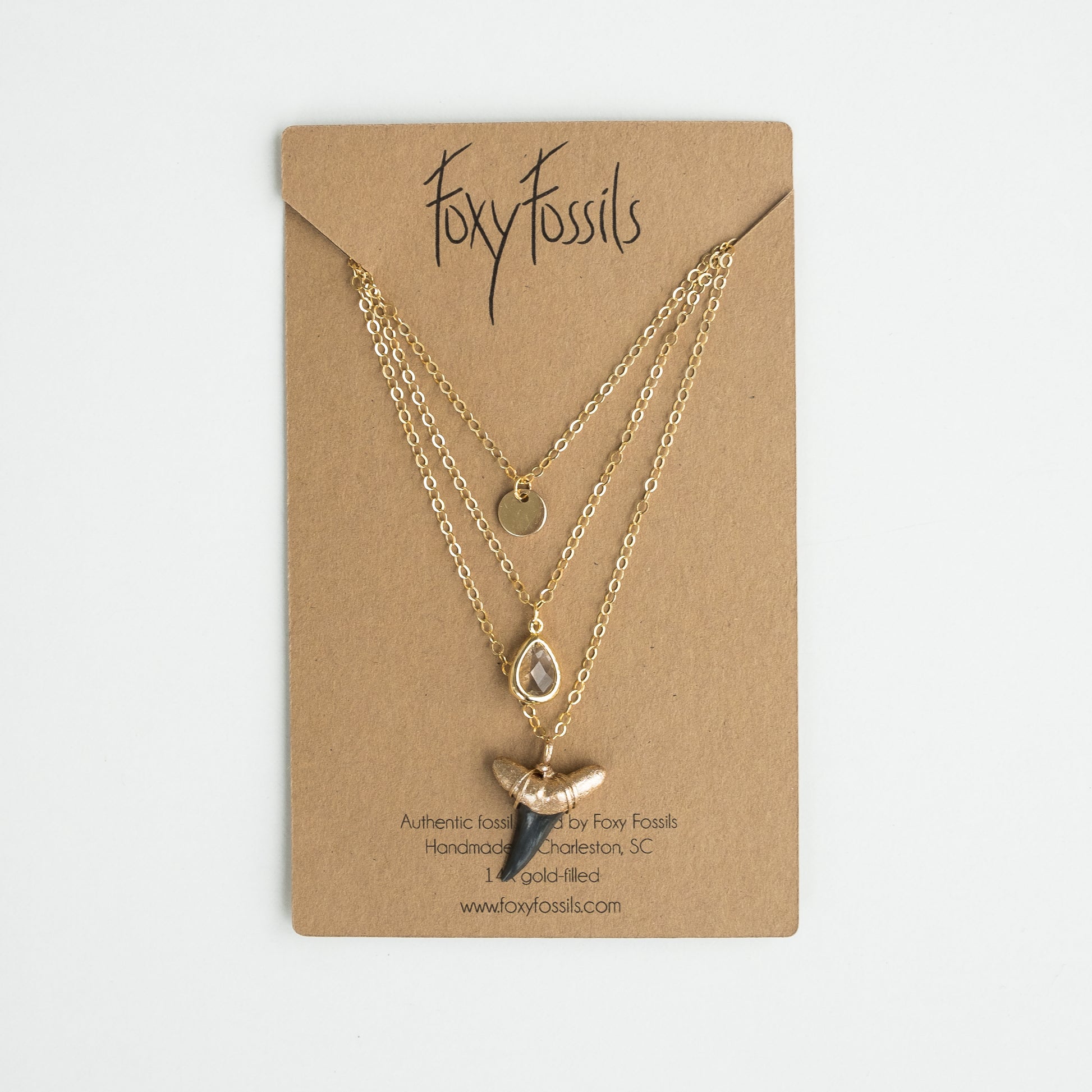 triple layer gold shark tooth necklace with real fossil shark tooth dipped in gold