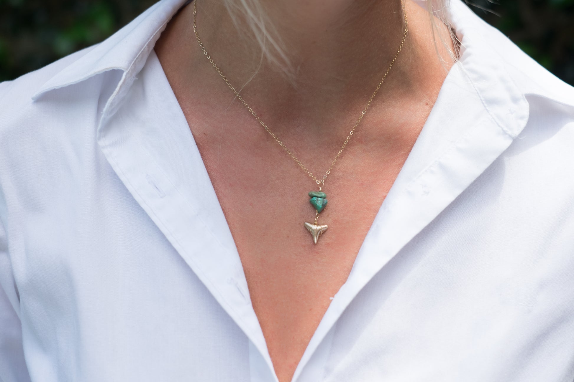elegant gold shark tooth fossil pendant necklace in gold with turquoise gemstones worn by model—gold shark tooth necklace —Foxy Fossils 